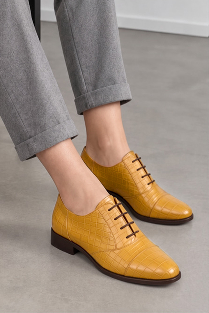 Women's mustard yellow classic oxfords and derby shoes with round toe and chunky rubber lug sole - Worn view